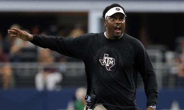 FILE - In this Sept. 23, 2017, file photo, Texas A&M head coach Kevin Sumlin talks to an offici...