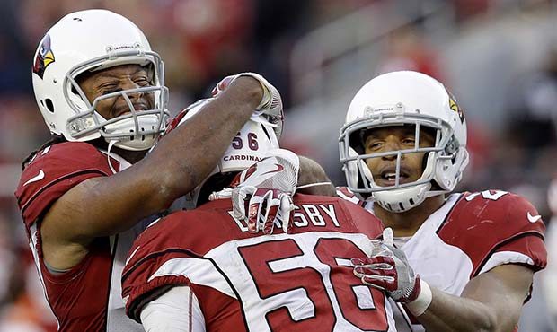 Arizona Cardinals inside linebacker Karlos Dansby (56) celebrates with Larry Fitzgerald, left, and ...