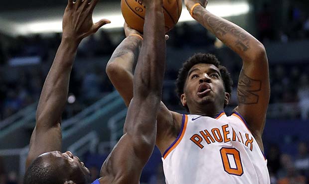 Phoenix Suns forward Marquese Chriss (0) shoots over Orlando Magic center Bismack Biyombo (11) duri...