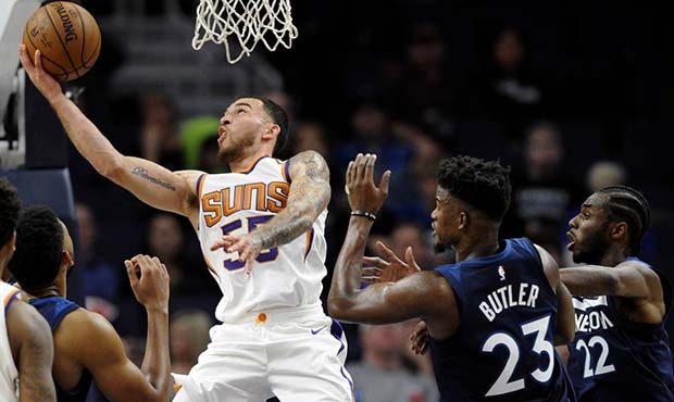 Phoenix Suns' Mike James (55) shoots against center Minnesota Timberwolves' Jimmy Butler (23) and A...