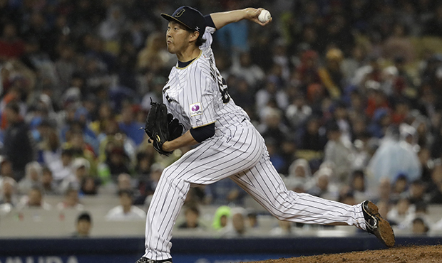 Japan's Yoshihisa Hirano throws during the ninth inning of a semifinal in the World Baseball Classi...