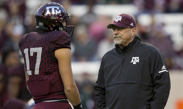 Texas A&M offensive coordinator Noel Mazzone watches warmups before the start of a NCAA college...