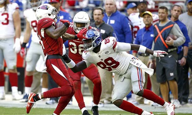 Arizona Cardinals strong safety Antoine Bethea is hit by New York Giants tight end Jerell Adams (89...