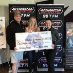 (Arizona Sports Photo) GM John Nissen and Earnhardt Ford donating at Burns and Gambo's Holiday Heroes event which raised thousands for the 100 Club of Arizona and first responders.