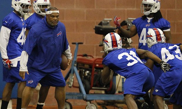 Buffalo Bills defensive backs coach Donnie Henderson instructs players during their NFL football ro...