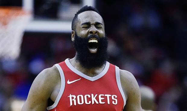 Houston Rockets guard James Harden (13) reacts after teammate PJ Tucker made a basket and was foule...