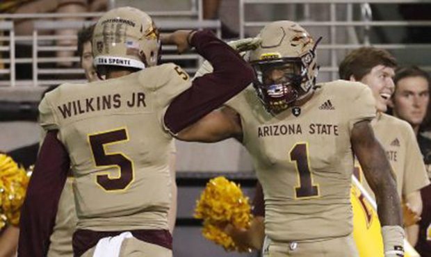 Arizona State quarterback Manny Wilkins (5) wide receiver N'Keal Harry (1) after a touchdown agains...
