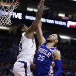 Philadelphia 76ers guard Ben Simmons (25) has his shot blocked by Phoenix Suns forward Marquese Chriss (0) during the first half of an NBA basketball game Sunday, Dec. 31, 2017, in Phoenix. (AP Photo/Ross D. Franklin)