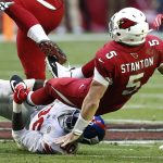 Arizona Cardinals quarterback Drew Stanton (5) is sacked by New York Giants defensive tackle Jay Bromley during the first half of an NFL football game, Sunday, Dec. 24, 2017, in Glendale, Ariz. (AP Photo/Ross D. Franklin)