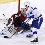 Tampa Bay Lightning center Brayden Point (21) scores a goal against Arizona Coyotes goalie Antti Raanta (32) during the first period of an NHL hockey game, Thursday, Dec. 14, 2017, in Glendale, Ariz. (AP Photo/Ross D. Franklin)