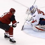 Washington Capitals goalie Philipp Grubauer (31) makes a save on a breakaway shot by Arizona Coyotes right wing Tobias Rieder (8) during the third period of an NHL hockey game Friday, Dec. 22, 2017, in Glendale, Ariz. The Coyotes defeated the Capitals 3-2 in overtime. (AP Photo/Ross D. Franklin)