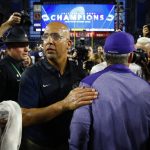 Penn State head coach James Franklin, front left, greets Washington head coach Chris Petersen, right, after the Fiesta Bowl NCAA college football game Saturday, Dec. 30, 2017, in Glendale, Ariz.  (AP Photo/Ross D. Franklin)