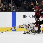 Vegas Golden Knights defenseman Luca Sbisa (47) dives for the puck with pressure from Arizona Coyotes left wing Anthony Duclair during the first period of an NHL hockey game, Sunday, Dec. 3, 2017, in Las Vegas. (AP Photo/David Becker)