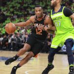 Phoenix Suns forward T.J. Warren (12) drives against Minnesota Timberwolves center Taj Gibson (67) in the first quarter of an NBA basketball game on Saturday, Dec. 16, 2017, in Minneapolis. (AP Photo/Andy Clayton-King)