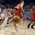 Phoenix Suns guard Tyler Ulis (8) dives for the ball as Toronto Raptors guard Kyle Lowry (7) and Jakob Poeltl (42) watch during the first half of an NBA basketball game Tuesday, Dec. 5, 2017, in Toronto. (Nathan Denette/The Canadian Press via AP