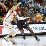 Arizona's Rawle Alkins tries to dribble past New Mexico's Dane Kuiper in the first half of an NCAA college basketball game, Saturday, Dec. 16, 2017, in Albuquerque, N.M. (AP Photo/Eric Draper)