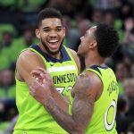 Minnesota Timberwolves center Karl Anthony-Towns (32) and guard Jeff Teague (0) celebrate in the first quarter of an NBA basketball game  against the Phoenix Suns, Saturday, Dec. 16, 2017, in Minneapolis. (AP Photo/Andy Clayton-King)