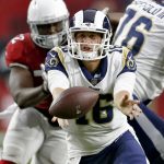 Los Angeles Rams quarterback Jared Goff (16) hands off against the Arizona Cardinals during the first half of an NFL football game, Sunday, Dec. 3, 2017, in Glendale, Ariz. (AP Photo/Ross D. Franklin)