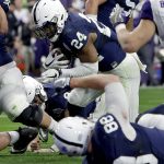 Penn State running back Miles Sanders (24) scores a running touchdown against Washington during the first half of the Fiesta Bowl NCAA college football game, Saturday, Dec. 30, 2017, in Glendale, Ariz. (AP Photo/Rick Scuteri)