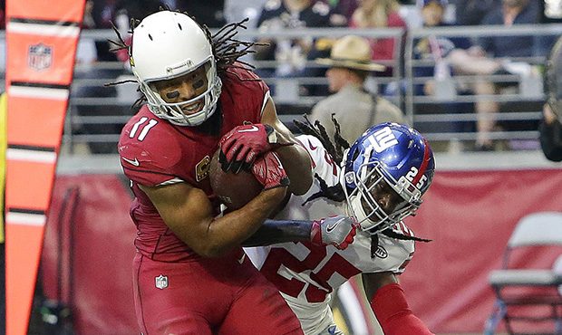 Arizona Cardinals wide receiver Larry Fitzgerald (11) scores a touchdown as New York Giants defensi...