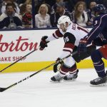 Arizona Coyotes' Brad Richardson, left, moves the puck as Columbus Blue Jackets' Seth Jones defends during the first period of an NHL hockey game Saturday, Dec. 9, 2017, in Columbus, Ohio. (AP Photo/Jay LaPrete)
