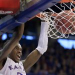Kansas guard Lagerald Vick dunks during the first half of an NCAA college basketball game against Arizona State in Lawrence, Kan., Sunday, Dec. 10, 2017. (AP Photo/Orlin Wagner)