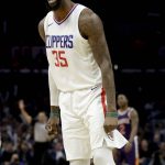 Los Angeles Clippers center Willie Reed celebrates after making a basket against the Phoenix Suns during the second half of an NBA basketball game in Los Angeles, Wednesday, Dec. 20, 2017. The Clippers won 108-95. (AP Photo/Chris Carlson)