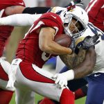 Arizona Cardinals running back D.J. Foster (37) is hit by Los Angeles Rams nose tackle Michael Brockers during the first half of an NFL football game, Sunday, Dec. 3, 2017, in Glendale, Ariz. (AP Photo/Ross D. Franklin)