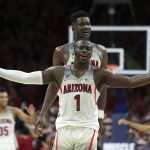 Arizona's Rawle Alkins (1) and Deandre Ayton celebrate during the final seconds of the team's 84-78 victory over No. 3 Arizona State during an NCAA college basketball game Saturday, Dec. 30, 2017, in Tucson, Ariz. (AP Photo/Ralph Freso)