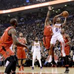 Phoenix Suns guard Tyler Ulis (8) drives to the basket as Toronto Raptors guard Kyle Lowry (7) attempts to defend during the first half of an NBA basketball game Tuesday, Dec. 5, 2017, in Toronto. (Nathan Denette/The Canadian Press via AP