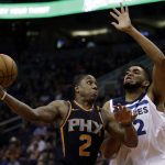 Phoenix Suns guard Isaiah Canaan (2) shoots over Minnesota Timberwolves center Karl-Anthony Towns in the third quarter during an NBA basketball game, Saturday, Dec. 23, 2017, in Phoenix. (AP Photo/Rick Scuteri)