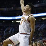 Phoenix Suns guard Devin Booker watches a 3-pointer go in during the first half of an NBA basketball game against the Memphis Grizzlies, Tuesday, Dec. 26, 2017, in Phoenix. (AP Photo/Ross D. Franklin)