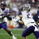 Washington defensive back Austin Joyner (4) intercepts a pass intended for Penn State wide receiver DeAndre Thompkins (3) as Washington defensive back Taylor Rapp (21) moves in during the second half of the Fiesta Bowl NCAA college football game, Saturday, Dec. 30, 2017, in Glendale, Ariz. (AP Photo/Ross D. Franklin)