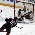 Arizona Coyotes goalie Antti Raanta (32) blocks a shot by Anaheim Ducks defenseman Josh Manson (42) in the first period of an NHL hockey game in Anaheim, Calif., Sunday, Dec. 31, 2017. (AP Photo/Reed Saxon)