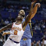 Phoenix Suns guard Tyler Ulis (8) gets his shot blocked by Memphis Grizzlies center Marc Gasol (33) during the first half of an NBA basketball game, Tuesday, Dec. 26, 2017, in Phoenix. (AP Photo/Ross D. Franklin)