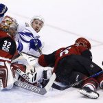 Arizona Coyotes defenseman Jakob Chychrun (6) and Tampa Bay Lightning right wing Ryan Callahan, middle, collide into Coyotes goalie Antti Raanta (32) during the first period of an NHL hockey game, Thursday, Dec. 14, 2017, in Glendale, Ariz. (AP Photo/Ross D. Franklin)