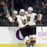 Vegas Golden Knights right wing Alex Tuch (89) celebrates with teammate Colin Miller after scoring a goal against the Arizona Coyotes during the second period of an NHL hockey game, Sunday, Dec. 3, 2017, in Las Vegas. (AP Photo/David Becker)