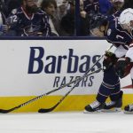Columbus Blue Jackets' Jack Johnson, left, and Arizona Coyotes' Kevin Connauton chase a loose puck during the second period of an NHL hockey game Saturday, Dec. 9, 2017, in Columbus, Ohio. (AP Photo/Jay LaPrete)