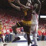 Arizona State guard Shannon Evans II (11) drives to the basket past Arizona's Rawle Alkins during the first half of an NCAA college basketball game Saturday, Dec. 30, 2017, in Tucson, Ariz. (AP Photo/Ralph Freso)