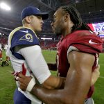 Los Angeles Rams quarterback Jared Goff, left, greets Arizona Cardinals wide receiver Larry Fitzgerald after an NFL football game, Sunday, Dec. 3, 2017, in Glendale, Ariz. The Rams won 32-16. (AP Photo/Rick Scuteri)