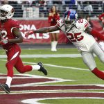 Arizona Cardinals wide receiver John Brown (12) scores a touchdown as New York Giants defensive back Brandon Dixon (25) defends during the second half of an NFL football game, Sunday, Dec. 24, 2017, in Glendale, Ariz. (AP Photo/Ross D. Franklin)
