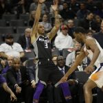 Phoenix Suns forward TJ Warren, right, points out that Sacramento Kings guard George Hill is out of bounds during the first quarter of an NBA basketball game Tuesday, Dec. 12, 2017, in Sacramento, Calif. (AP Photo/Rich Pedroncelli)