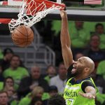 Minnesota Timberwolves center Taj Gibson (67) dunks against the Phoenix Suns in the second quarter of an NBA basketball game on Saturday, Dec. 16, 2017, in Minneapolis. (AP Photo/Andy Clayton-King)