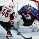 Colorado Avalanche goalie Semyon Varlamov, right, of Russia, makes a stick save against a shot by Arizona Coyotes right wing Josh Archibald (45) in the first period of an NHL hockey game Wednesday, Dec. 27, 2017, in Denver. (AP Photo/David Zalubowski)