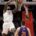 Los Angeles Clippers center DeAndre Jordan dunks as Phoenix Suns center Alex Len watches during the first half of an NBA basketball game in Los Angeles, Wednesday, Dec. 20, 2017. (AP Photo/Chris Carlson)