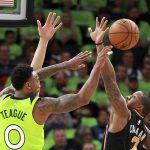 Minnesota Timberwolves guard Jeff Teague (0) throws under pressure from Phoenix Suns guard Isaiah Canaan (2) in the first quarter of an NBA basketball game on Saturday, Dec. 16, 2017, in Minneapolis. (AP Photo/Andy Clayton-King)