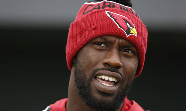 Chandler Jones of the Arizona Cardinals is interviewed before an NFL training session at the London...
