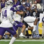 Penn State wide receiver DaeSean Hamilton (5) pulls in a touchdown pass as Washington defensive back Myles Bryant defends during the second half of the Fiesta Bowl NCAA college football game, Saturday, Dec. 30, 2017, in Glendale, Ariz. (AP Photo/Rick Scuteri)