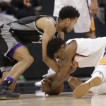 Sacramento Kings forward Skal Labissiere, left, and Phoenix Suns forward Marquese Chriss battle for the ball during the second half of an NBA basketball game Tuesday, Dec. 12, 2017, in Sacramento, Calif. The Kings won 99-92. (AP Photo/Rich Pedroncelli)