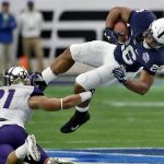 Penn State running back Saquon Barkley (26) is hit by Washington defensive back Taylor Rapp (21) during the first half of the Fiesta Bowl NCAA college football game Saturday, Dec. 30, 2017, in Glendale, Ariz. (AP Photo/Rick Scuteri)